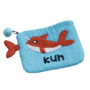 Handmade sky blue wool felt coin purse featuring narwhal design and kun text