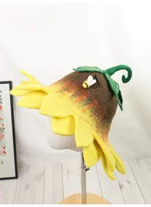 Detailed view of handmade sunflower wool felt hat with yellow petals and bee decor
