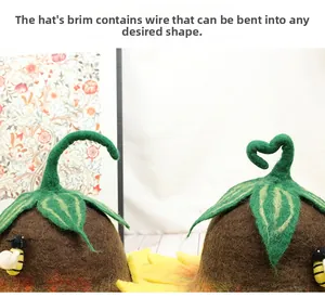 Detail view of the felt hat showing the bendable flower stem with internal wire and bee decoration