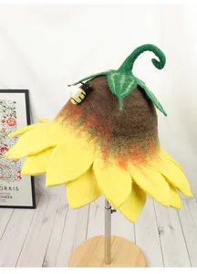 Detail of wool felt sunflower hat with 3D bee accent and handcrafted green stem leaves