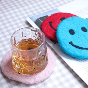 Cute smile wool felt coaster set for home decor and heat insulation on tabletop