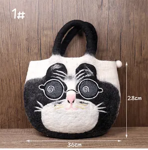 Detail of wool felt cat tote bag with size dimensions 36x28cm and black handles