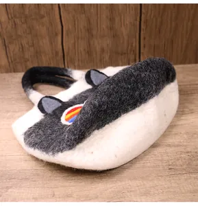Close-up of wool felt tote bag featuring 3D ears and colorful circular rainbow applique