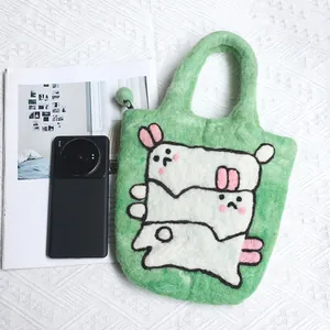 Handmade green wool felt phone bag featuring cute 3D bunny design with top handle