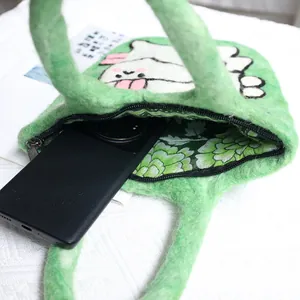 Handmade wool felt tote bag in green with cute white rabbit and floral lining