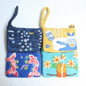 Handmade wool felt flower pouches with 3D embroidery and wristlets in four colors