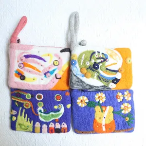 Handmade colorful wool felt flower pouches with 3D floral accents and wrist straps