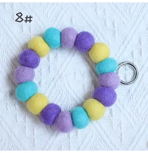 Macro shot of colorful wool felt ball keychain with silver spring clasp in style 8#