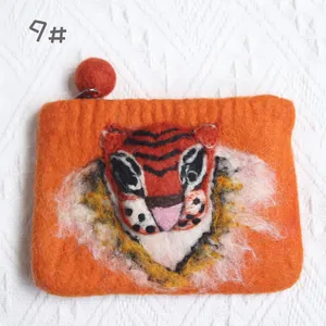 Handmade wool felt coin purse featuring a vivid 3D tiger head design with a red zipper pull
