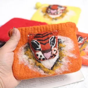Handmade wool felt tiger wallet featuring 3D animal design and bright orange texture