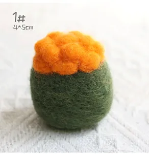 Close-up of wool felt sushi ornament in orange and green with macro texture details