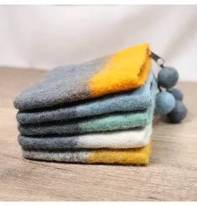 Set of five felt coin purses with color-block design and felt ball zipper charms