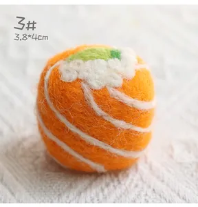 Macro shot of 3.8x4cm salmon sushi felt charm with detailed fiber texture and rice topping