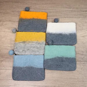 Morandi wool felt coin purses with pompom zippers in diverse bicolor combinations