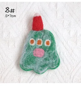 Detailed view of handmade wool felt brooch with red hat and 5x7cm size markings