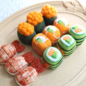 Handmade wool felt sushi set with realistic shrimp and maki rolls on a ceramic tray