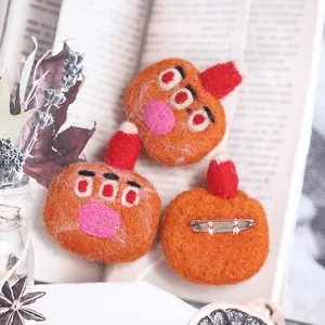 Three-piece set of handmade wool felt cartoon monster brooches with red hat and pins