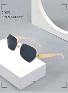 Close-up of golden geometric hexagonal frame sunglasses with dark lenses for 2025 style