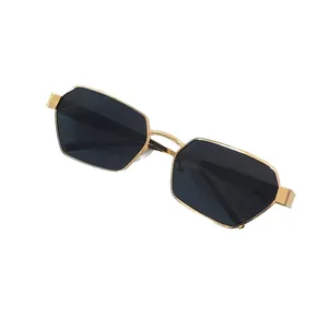 Modern hexagonal gold metal sunglasses with dark lenses for a stylish retro look