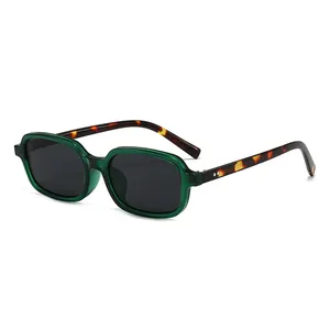Green transparent square sunglasses with tortoiseshell temples and dark lenses