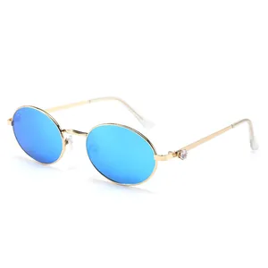 Occhiali da sole ovali rétro con lenti a specchio blu e montatura in metallo dorato