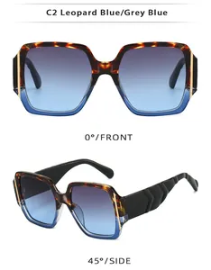 Detail of square leopard and blue sunglasses with gradient lenses and golden temple accents