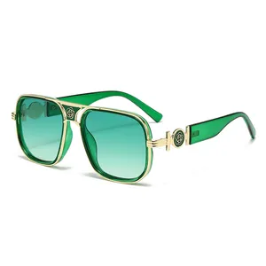 Classic oversized metal frame sunglasses with green gradient lenses and floral detail