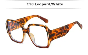 Detail of leopard print square frames with gold trim and textured C10 temple arms