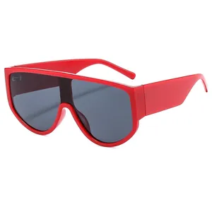 Modern oversized one-piece red sunglasses with dark grey lenses and chunky temples