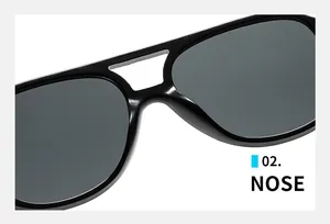 Detail view of the sleek double-bridge nose area on these black aviator sunglasses
