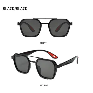 Detail view of black polygonal sunglasses with double bridge and red temple accents