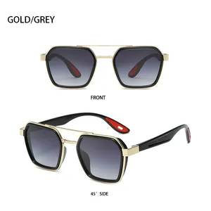 Close-up of gold and grey punk style sunglasses with double bridge and red temple tips