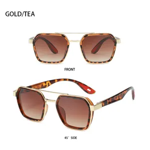 Detail view showing vintage gold double bridge sunglasses with tea gradient lenses