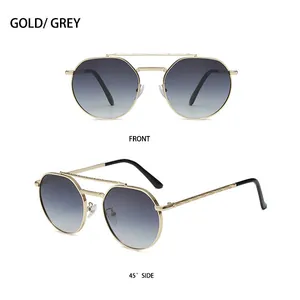 Detailed views of gold metal double bridge sunglasses with grey gradient lenses