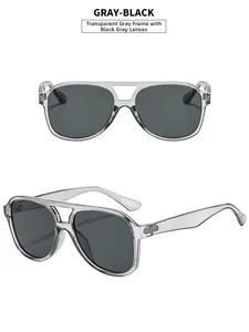 Detail view of transparent gray aviator sunglasses with double bridge and dark lenses