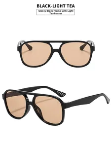 Detail view of pilot sunglasses featuring double-bridge black frame and light tea lenses