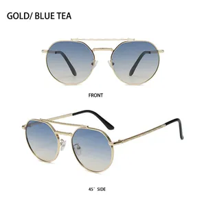 Detail of gold double-bridge metal frame with blue-tea gradient lenses sunglasses