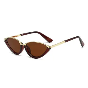 Vintage cat eye sunglasses with brown frame and gold metal temples in a side view