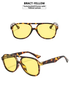 Detail view of aviator sunglasses with tortoiseshell frames and transparent yellow lenses