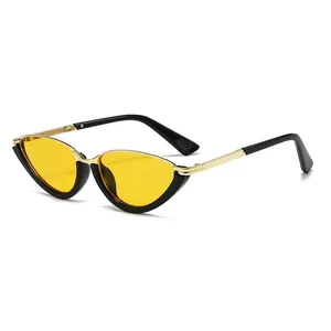 Retro cat-eye metal sunglasses with yellow transparent lenses and gold frame accents