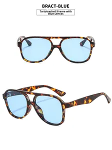 Detail view of double bridge pilot sunglasses with tortoise frame and blue lenses