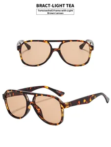 Detail view of double bridge pilot sunglasses with leopard frame and light tea lenses