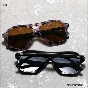Detail view of double bridge aviator sunglasses in tortoiseshell and black glossy finish