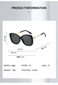 Detail view of golden metal temples with white pearl accents on large frame sunglasses