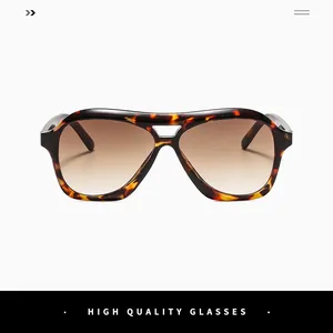 Close-up of tortoise shell aviator sunglasses with brown gradient lenses and rivet detail