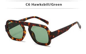 Gros plan détaillé de lunettes aviateur rétro avec monture écaille et verres verts