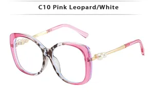Detail of pink leopard sunglasses with gold metal temples and white pearl accents