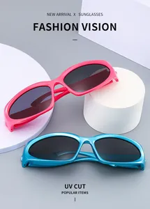 Close-up of pink and blue sport sunglasses with UV CUT protection on white pedestals