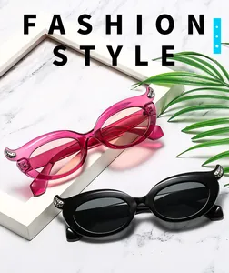 Close-up of retro cat-eye sunglasses featuring elegant rhinestone accents on corners