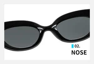 Macro detail of ergonomic nose pads on stylish black cat eye wide-frame sunglasses